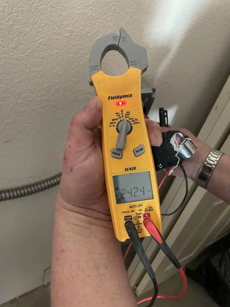 Voltage testing with clamp meter during Outlet Installation in Laurinburg